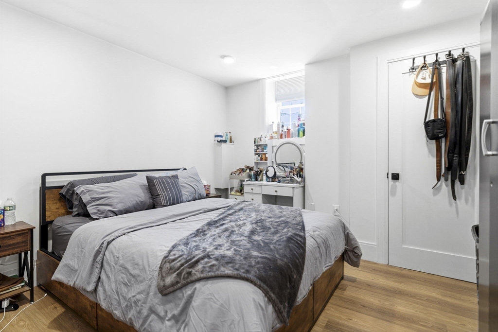 92 Chelsea Street, Unit 1 Boston, MA 02128 - Photo 7 of 14 a bedroom with a bed and a walk in closet