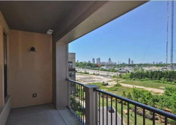 a view of a balcony with city view