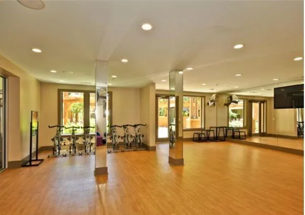 a lobby with furniture and floor to ceiling window