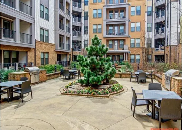 a view of a building with sitting area
