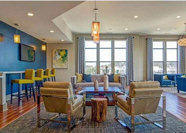 a living room with fireplace furniture and a window