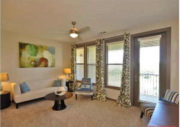 a living room with furniture and a window
