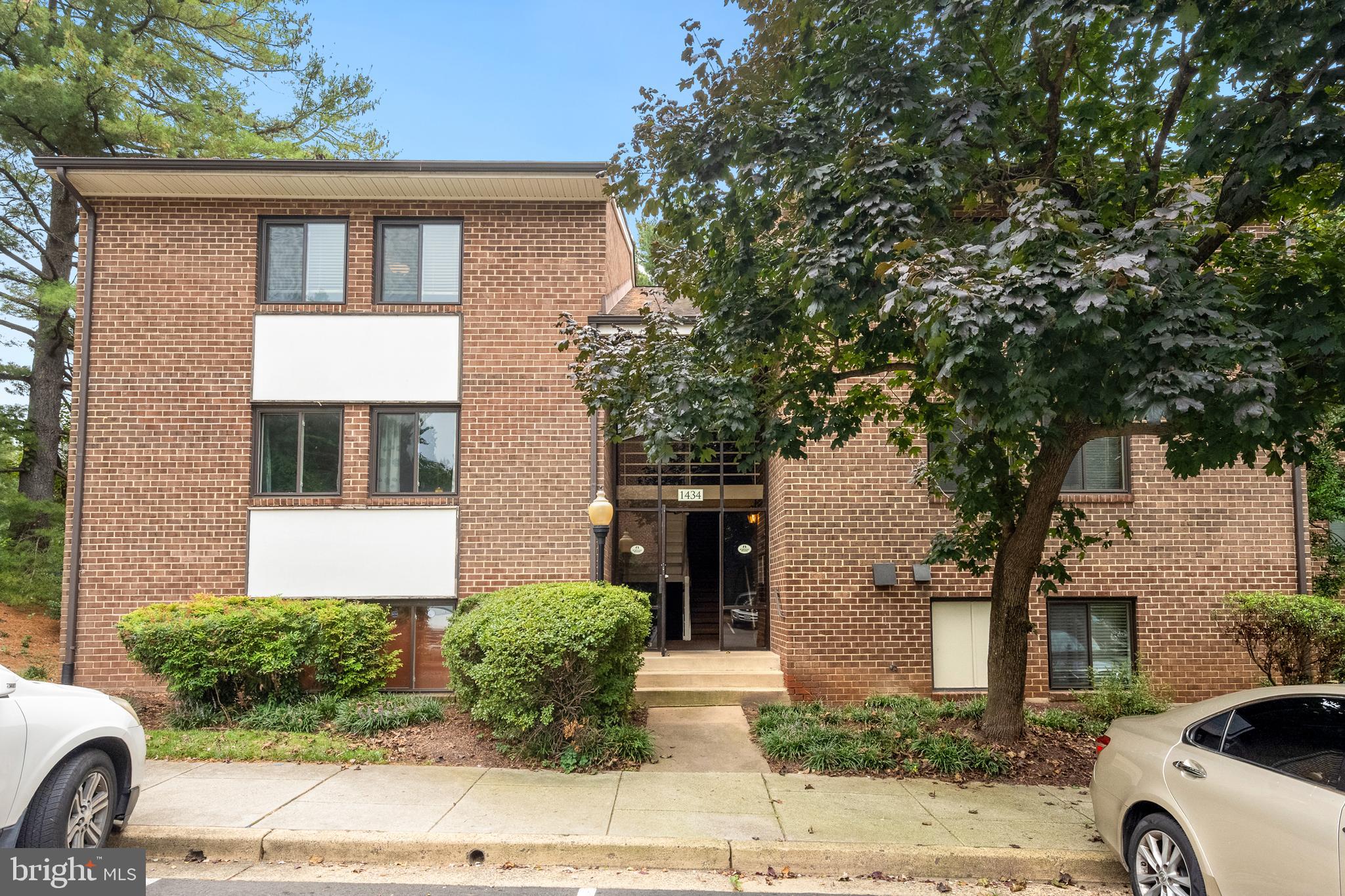 1434 Northgate Square, Unit 34/21B Reston, VA 20190 - Photo 1 of 44 a front view of a house with garden