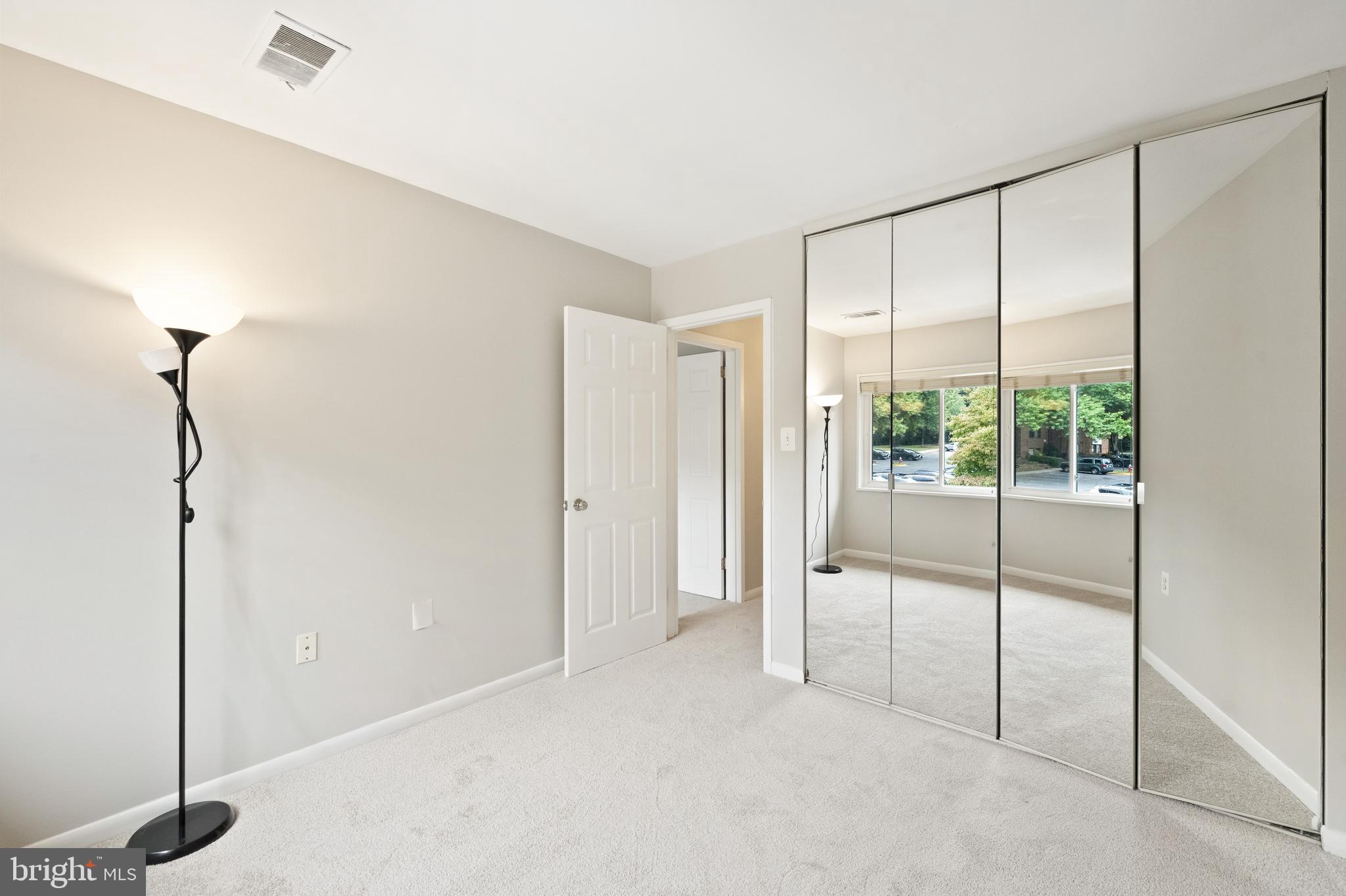 1434 Northgate Square, Unit 34/21B Reston, VA 20190 - Photo 19 of 44 a view of an empty room with glass door