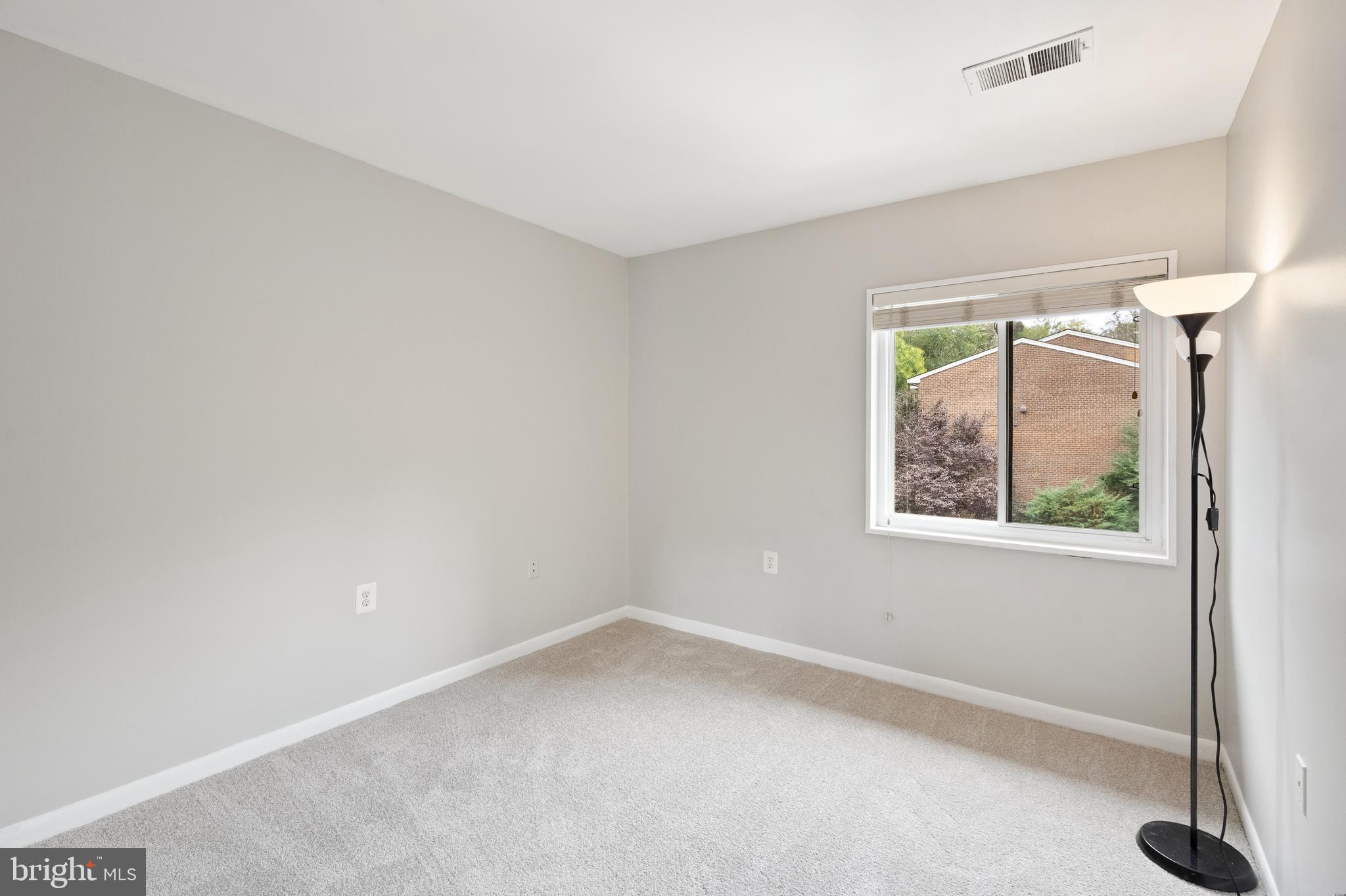 1434 Northgate Square, Unit 34/21B Reston, VA 20190 - Photo 20 of 44 an empty room with a window