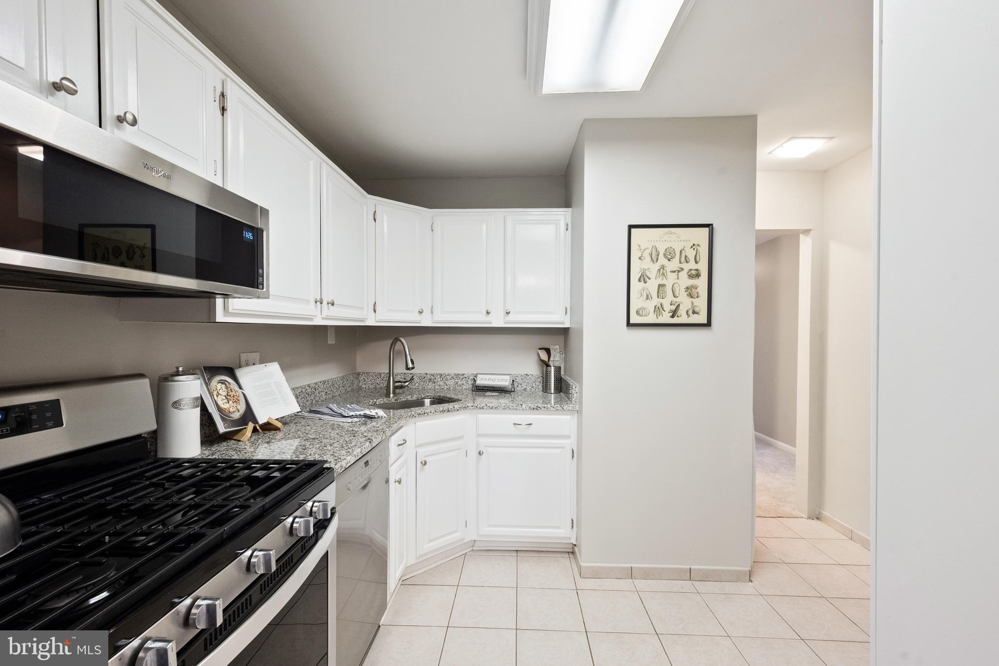 1434 Northgate Square, Unit 34/21B Reston, VA 20190 - Photo 2 of 44 a kitchen with cabinets and appliances