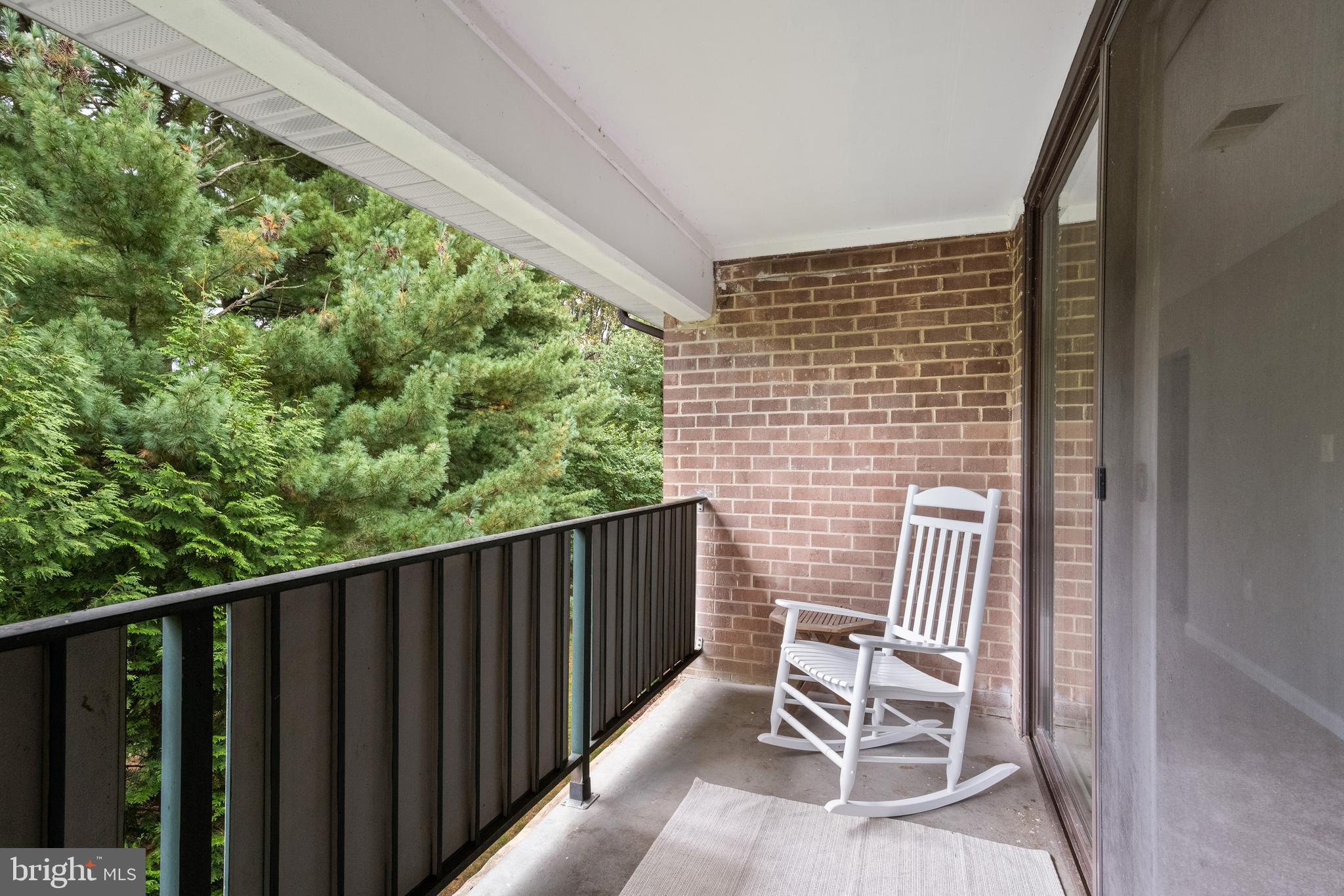 1434 Northgate Square, Unit 34/21B Reston, VA 20190 - Photo 25 of 44 a view of balcony with wooden floor and outdoor seating
