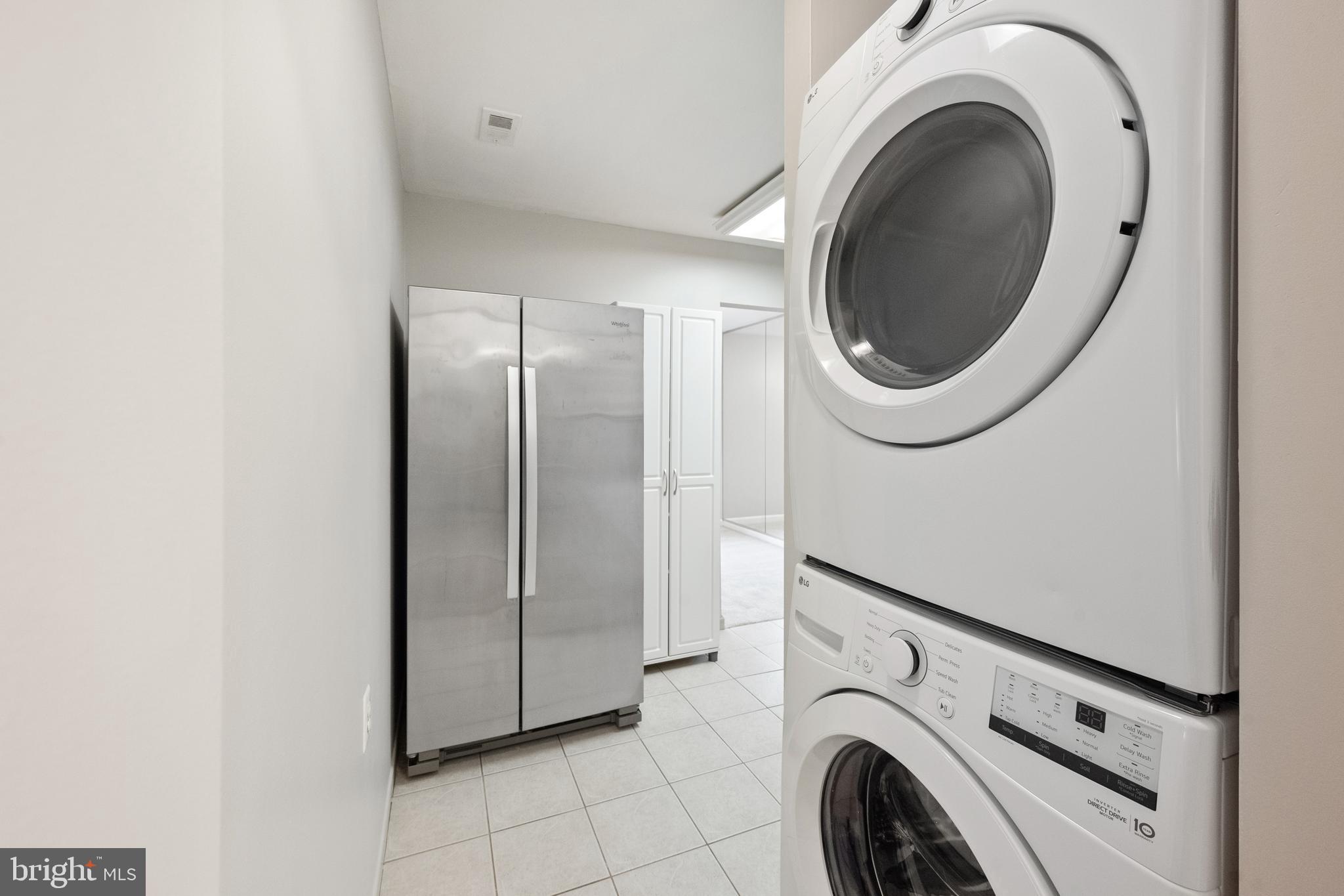 1434 Northgate Square, Unit 34/21B Reston, VA 20190 - Photo 5 of 44 a view of a storage & utility room with dryer and washer