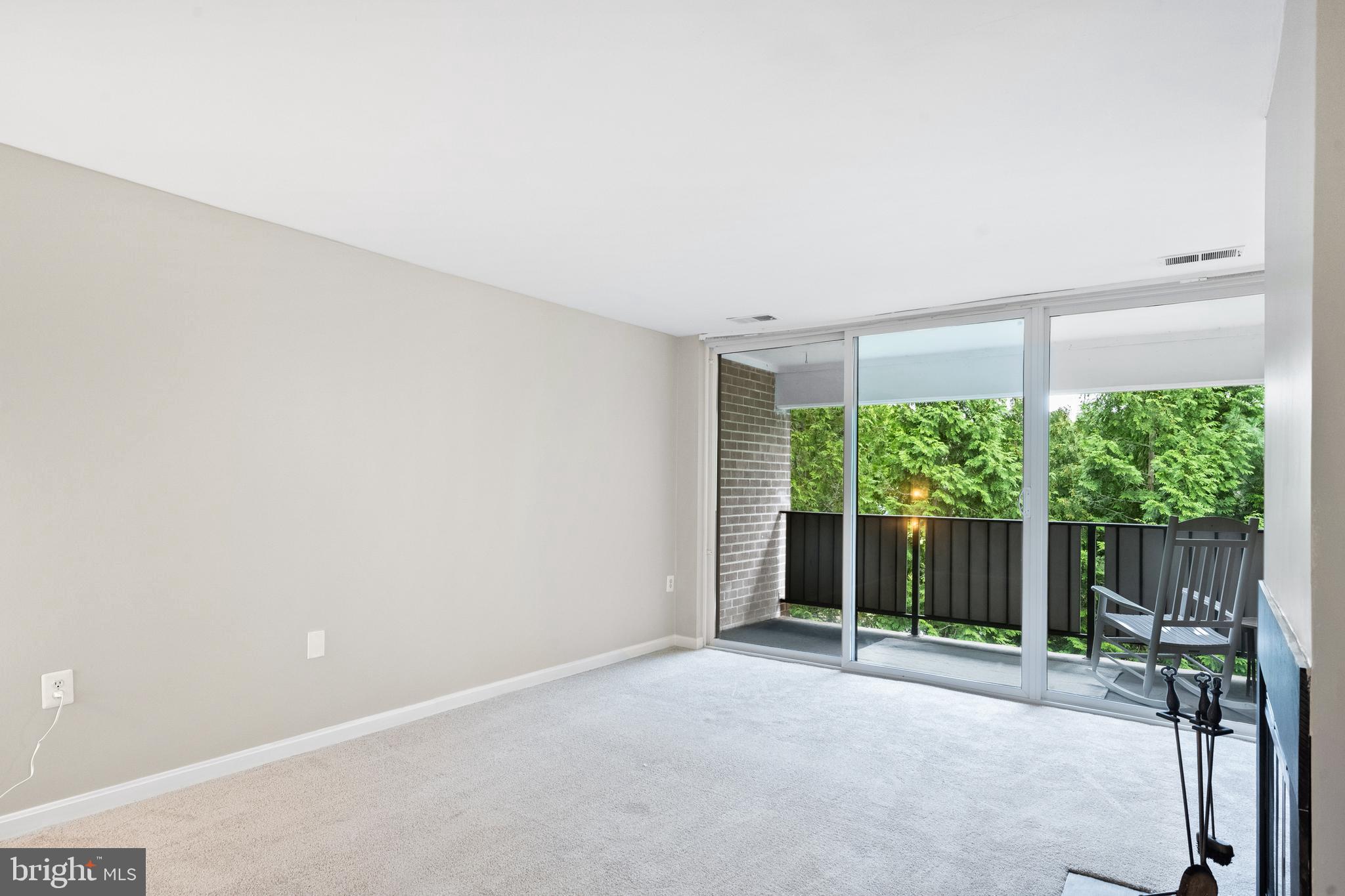 1434 Northgate Square, Unit 34/21B Reston, VA 20190 - Photo 9 of 44 a view of an empty room with wooden floor and outdoor seating