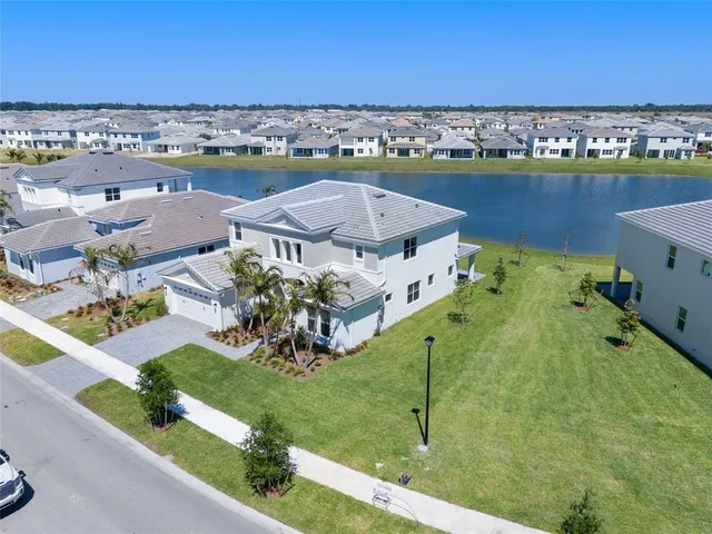 an aerial view of a house with a garden