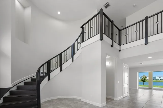 a view of staircase with lots of frames and view of stairs