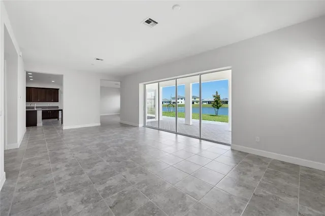a view of an empty room with glass door