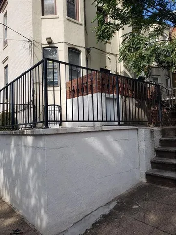 a view of balcony with wooden floor