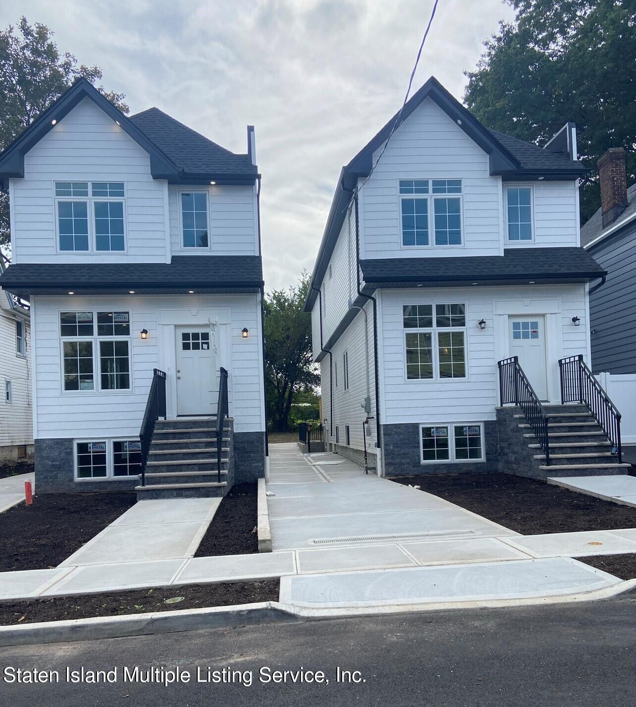 12 Trinity Place Staten Island, NY 10310 - Photo 1 of 31 a front view of a house with a yard