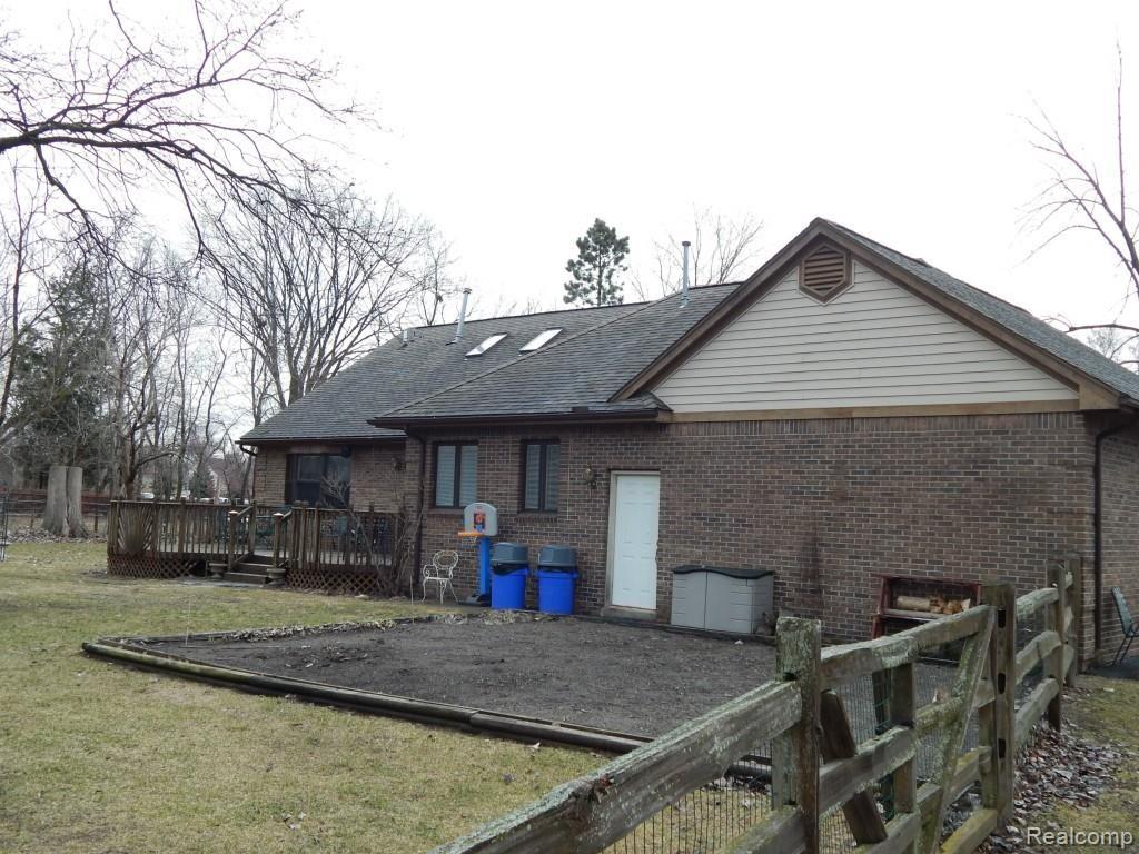 9219 Newburgh Road Livonia, MI 48150 - Photo 5 of 54 Rear of house with deck and large garden