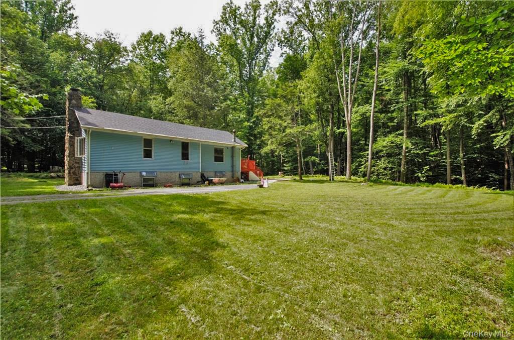 16 Woodland Road Middletown, NY 10940 - Photo 1 of 13 a front view of house with yard and green space