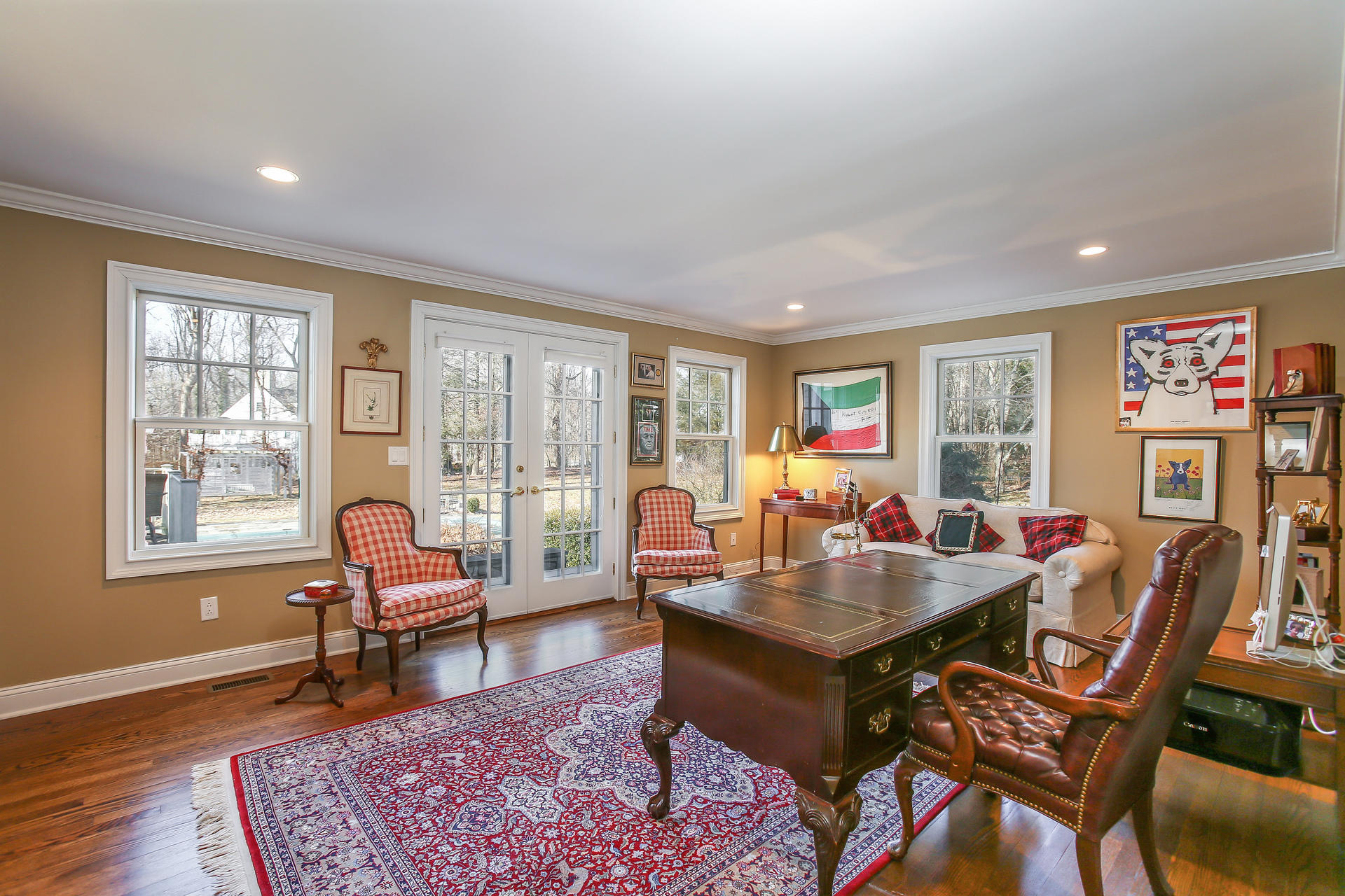 228 Ponus Ridge Road New Canaan, CT 06840 - Photo 15 of 47 a living room with furniture and a rug
