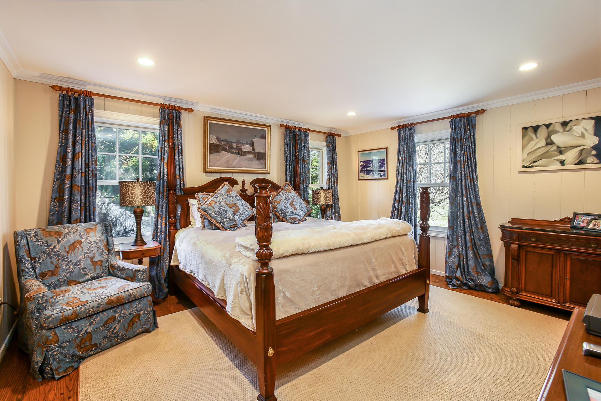 228 Ponus Ridge Road New Canaan, CT 06840 - Photo 16 of 47 a bedroom with a bed couch and a large window