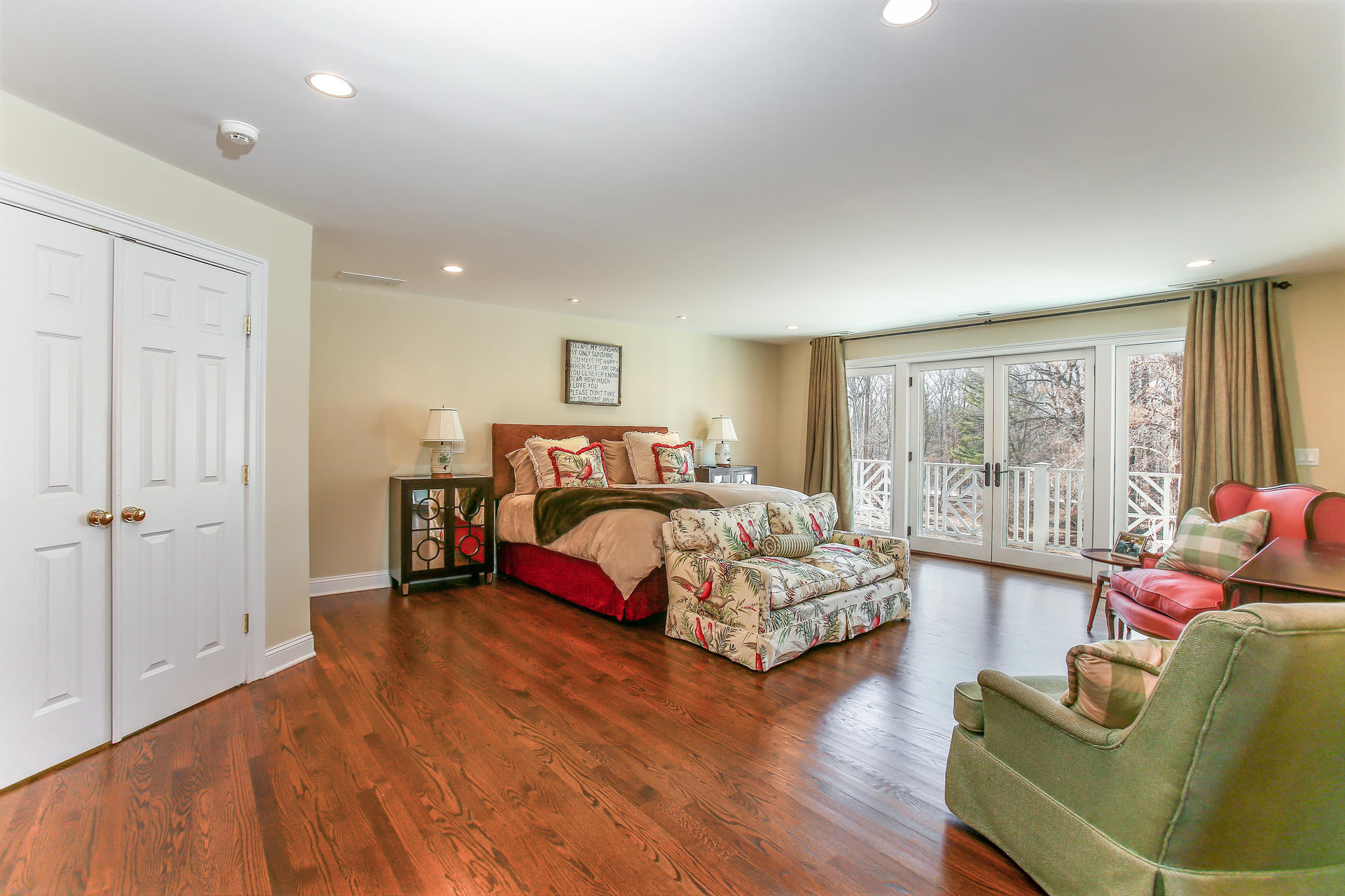 228 Ponus Ridge Road New Canaan, CT 06840 - Photo 19 of 47 a bedroom with a bed and wooden floor