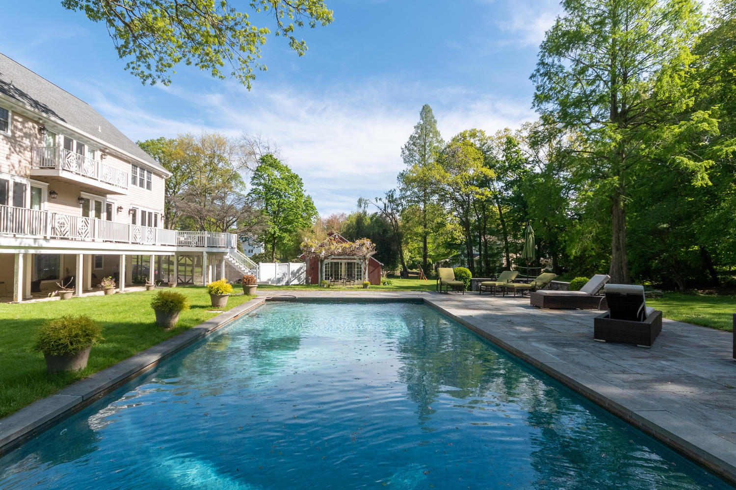 228 Ponus Ridge Road New Canaan, CT 06840 - Photo 2 of 47 a view of a house with pool