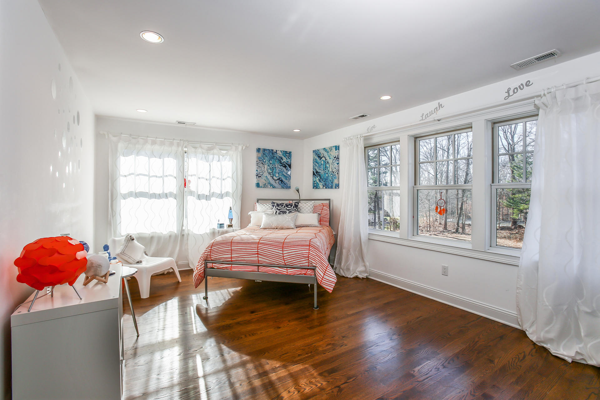 228 Ponus Ridge Road New Canaan, CT 06840 - Photo 22 of 47 a bedroom with a bed and wooden floor