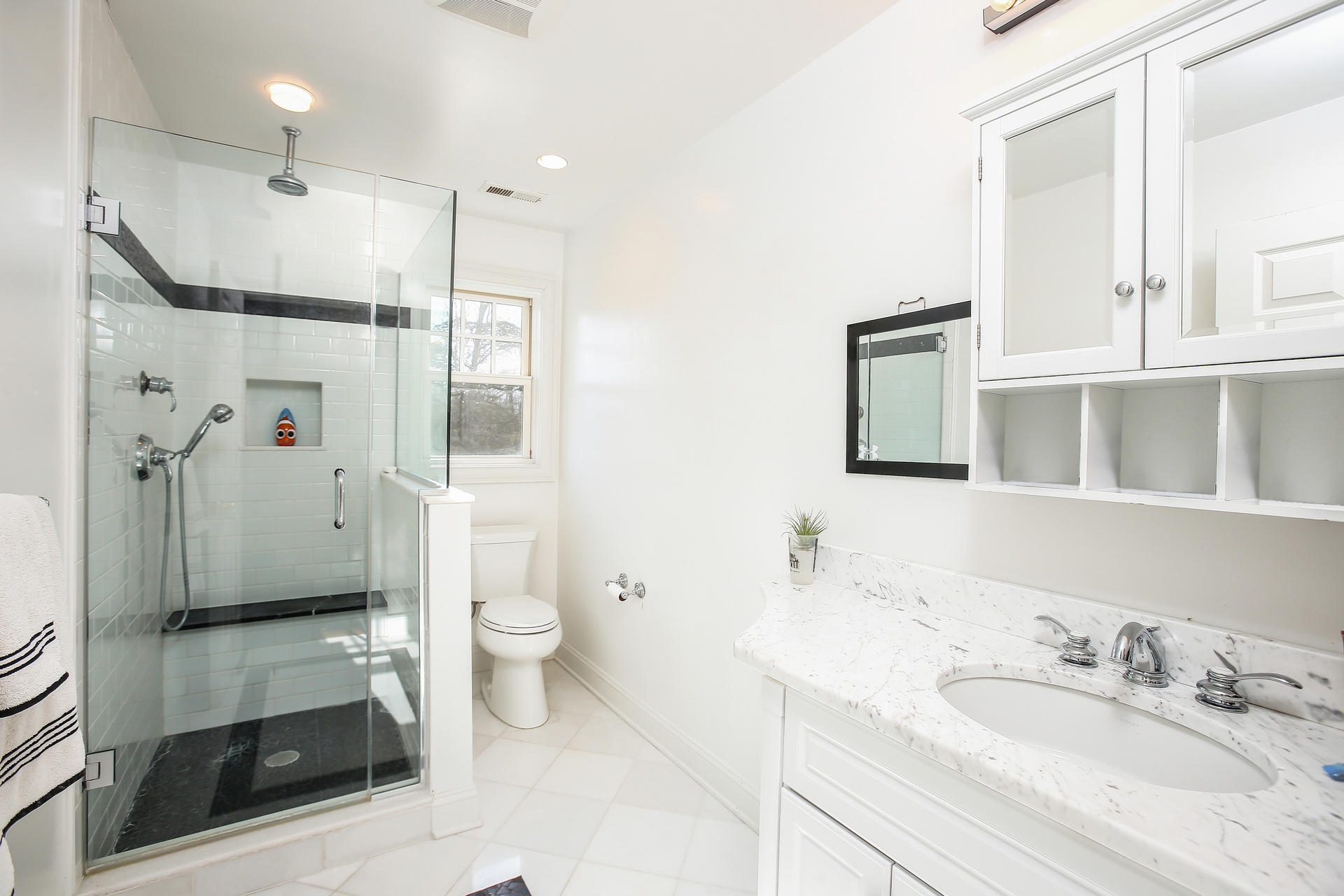 228 Ponus Ridge Road New Canaan, CT 06840 - Photo 25 of 47 a bathroom with a sink a toilet and shower