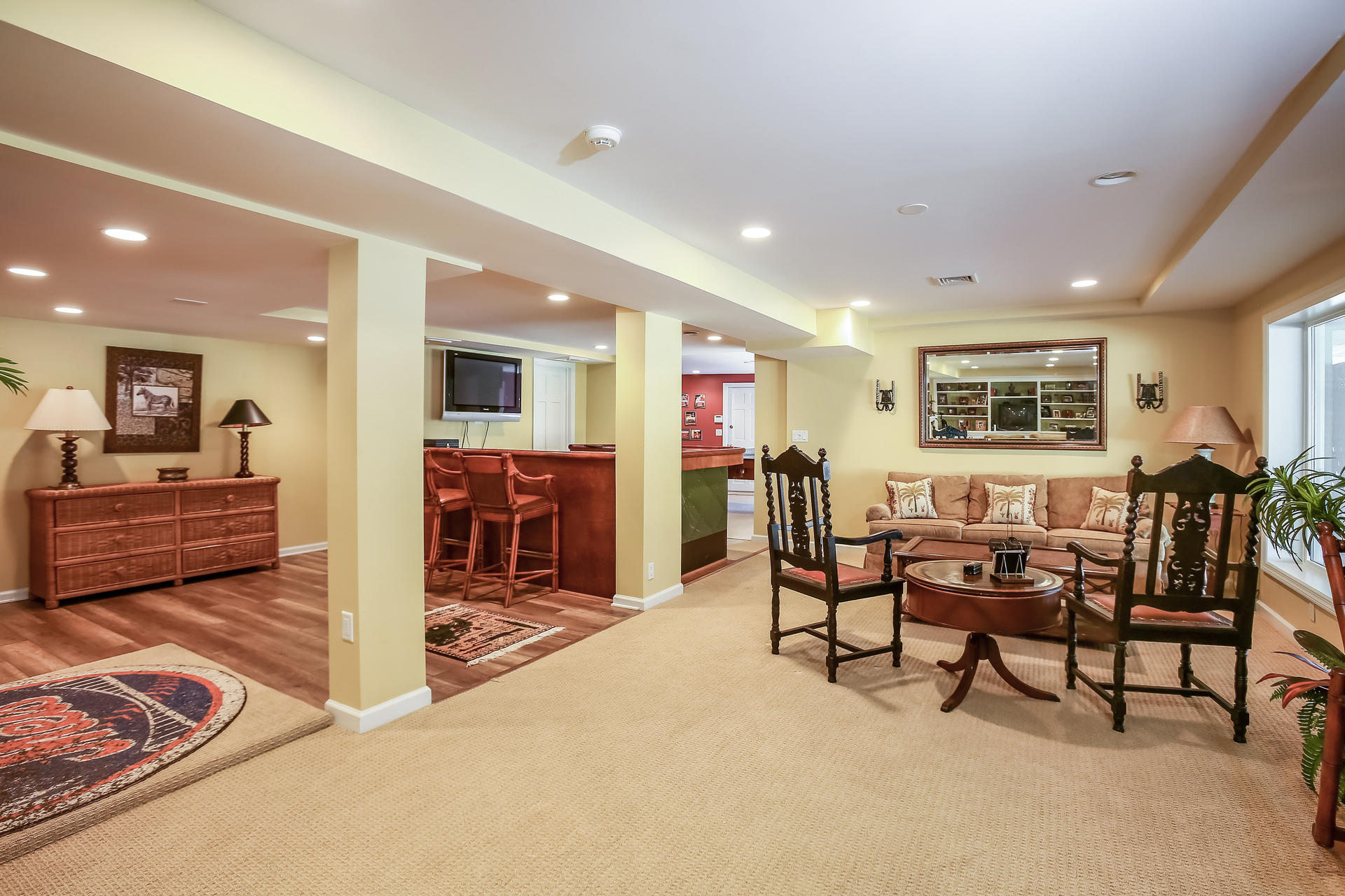228 Ponus Ridge Road New Canaan, CT 06840 - Photo 28 of 47 a view of a livingroom with furniture and a flat screen tv