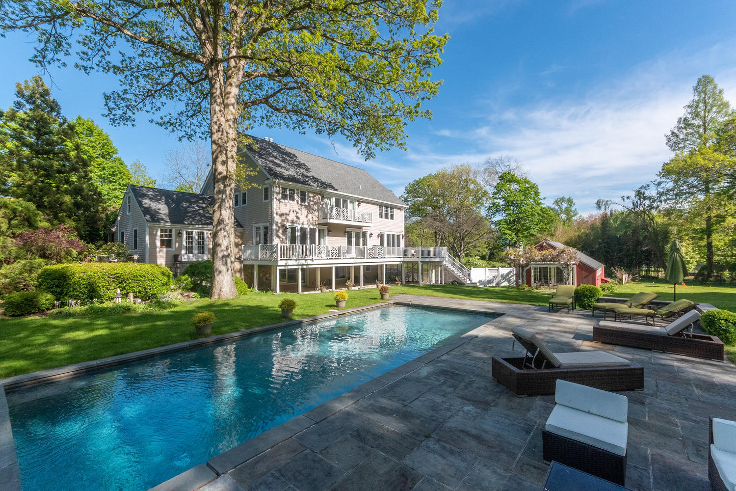 228 Ponus Ridge Road New Canaan, CT 06840 - Photo 36 of 47 a view of pool with outdoor seating and lake view