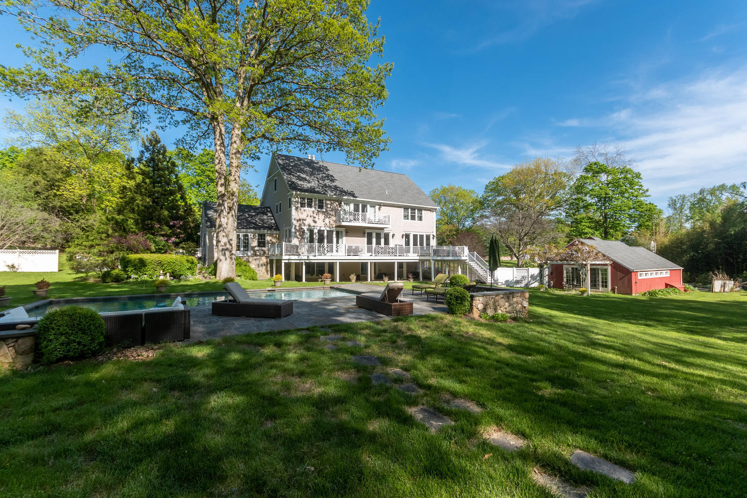 228 Ponus Ridge Road New Canaan, CT 06840 - Photo 38 of 47 a view of a house with a yard porch and sitting area