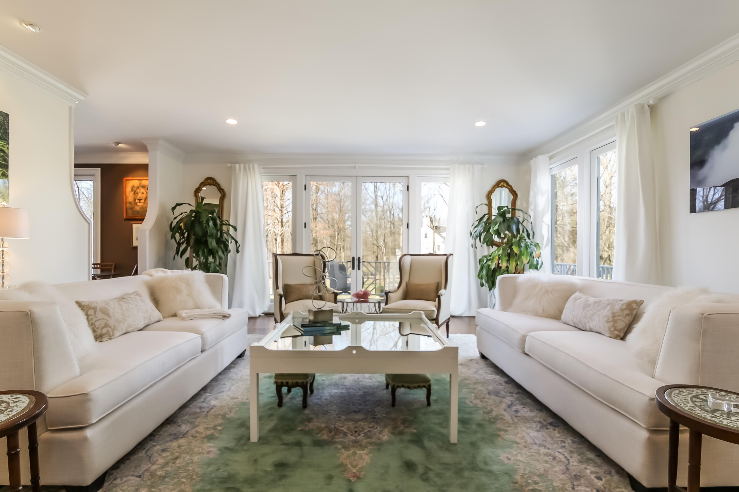228 Ponus Ridge Road New Canaan, CT 06840 - Photo 7 of 47 a living room with furniture potted plant and a window