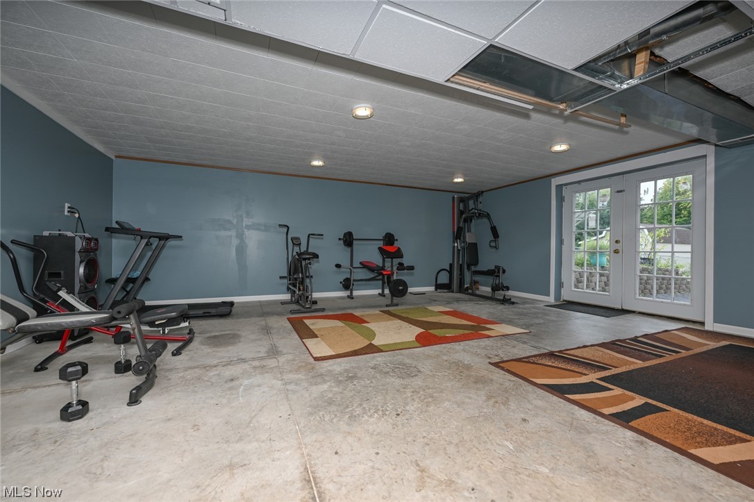 4574 Fishcreek Road Stow, OH 44224 - Photo 42 of 49 Exercise room featuring french doors and concrete floors
