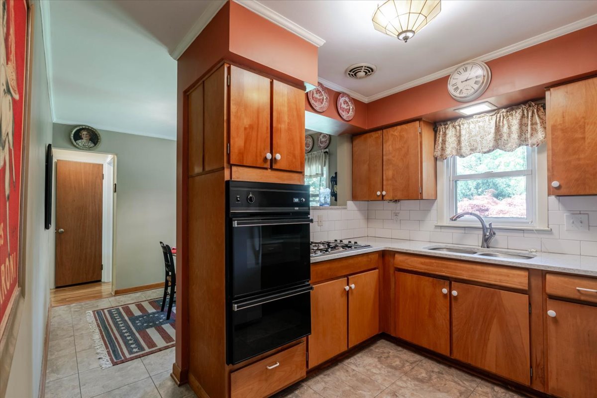 302 Radliff Road Bloomington, IL 61701 - Photo 13 of 35 a kitchen with stainless steel appliances granite countertop a refrigerator and a sink