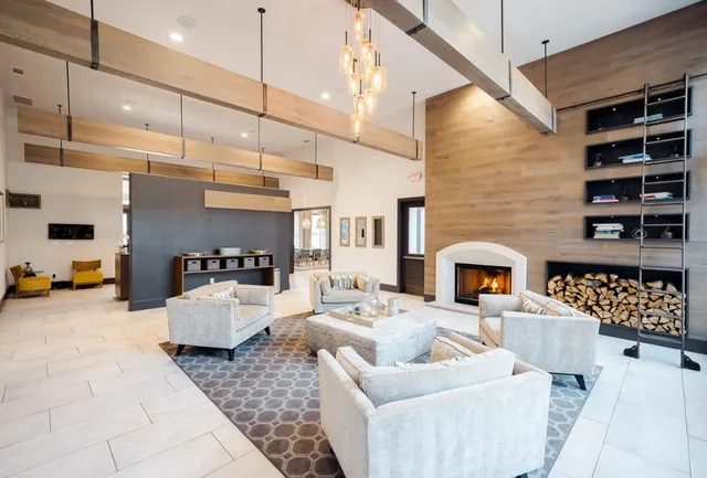 a living room with furniture and fireplace