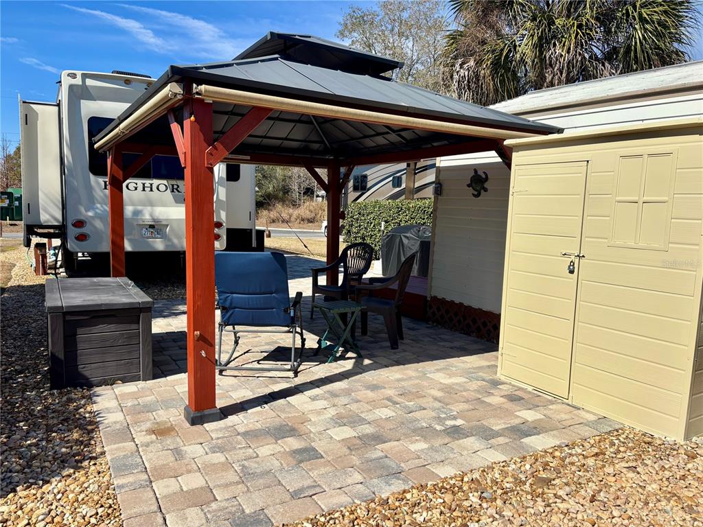 3047 Northeast 102nd Ave Road Silver Springs, FL 34488 - Photo 12 of 87 a view of a porch with furniture and floor to ceiling window