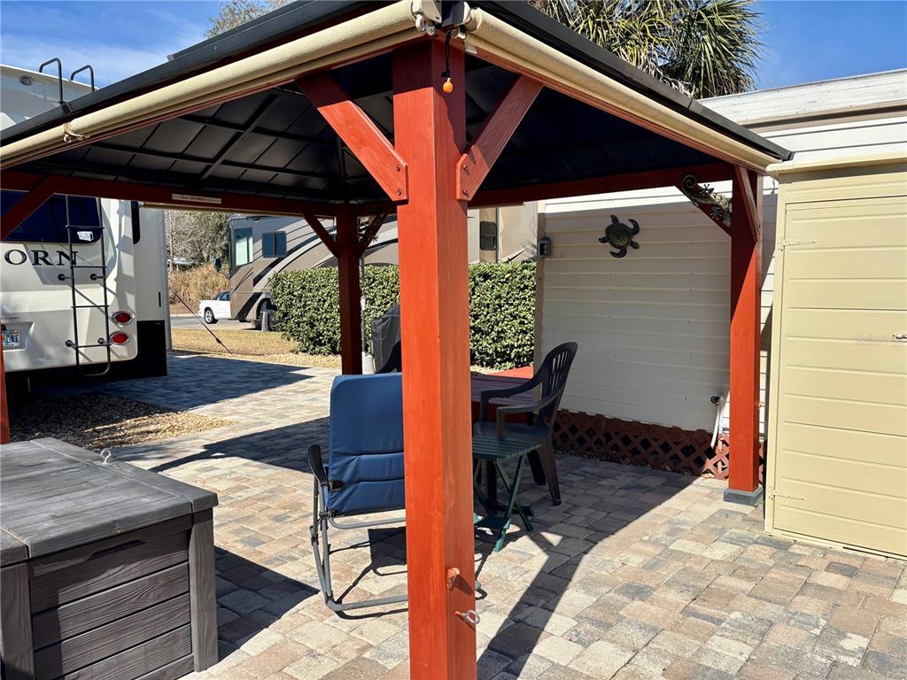 3047 Northeast 102nd Ave Road Silver Springs, FL 34488 - Photo 13 of 87 a patio with table and chairs