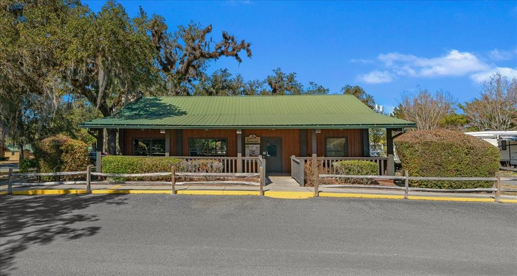 3047 Northeast 102nd Ave Road Silver Springs, FL 34488 - Photo 25 of 87 a view of house with swimming pool and yard