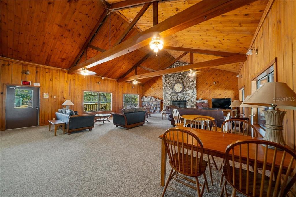 3047 Northeast 102nd Ave Road Silver Springs, FL 34488 - Photo 26 of 87 a view of a chairs and table in the back yard of the house