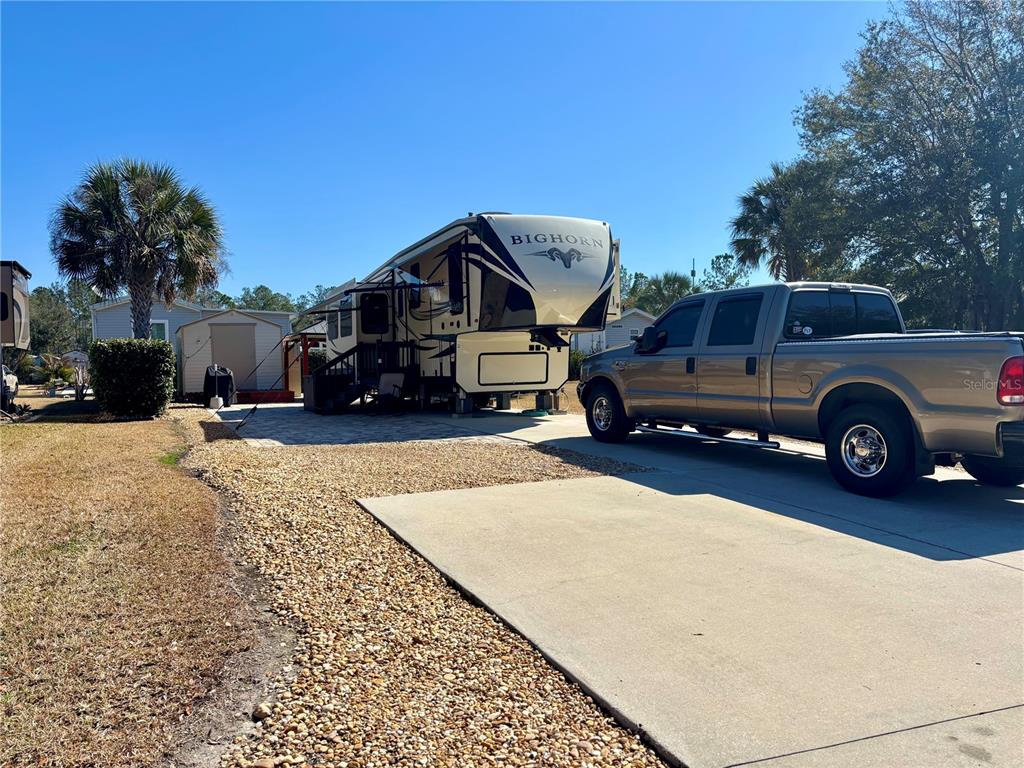 3047 Northeast 102nd Ave Road Silver Springs, FL 34488 - Photo 3 of 87 a car parked in front of a house