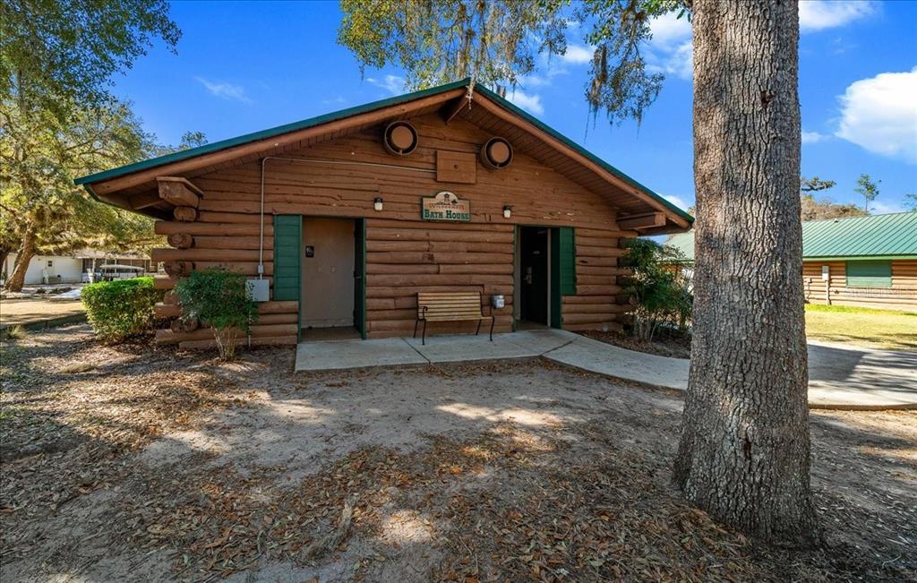 3047 Northeast 102nd Ave Road Silver Springs, FL 34488 - Photo 33 of 87 a front view of a house with a yard