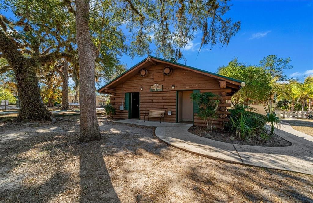 3047 Northeast 102nd Ave Road Silver Springs, FL 34488 - Photo 34 of 87 a front view of a house with a yard