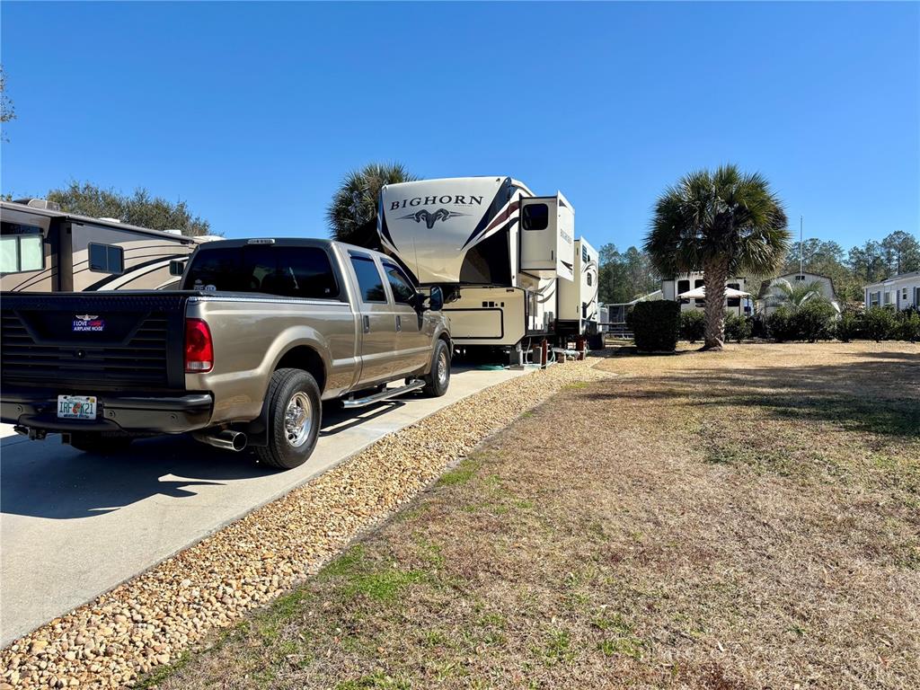 3047 Northeast 102nd Ave Road Silver Springs, FL 34488 - Photo 4 of 87 a view of a car in front of a house
