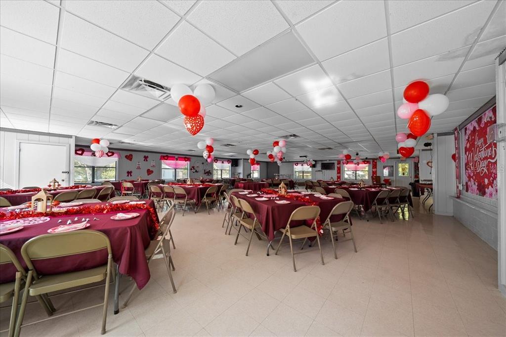 3047 Northeast 102nd Ave Road Silver Springs, FL 34488 - Photo 56 of 87 a outdoor space with furniture and a flat screen tv