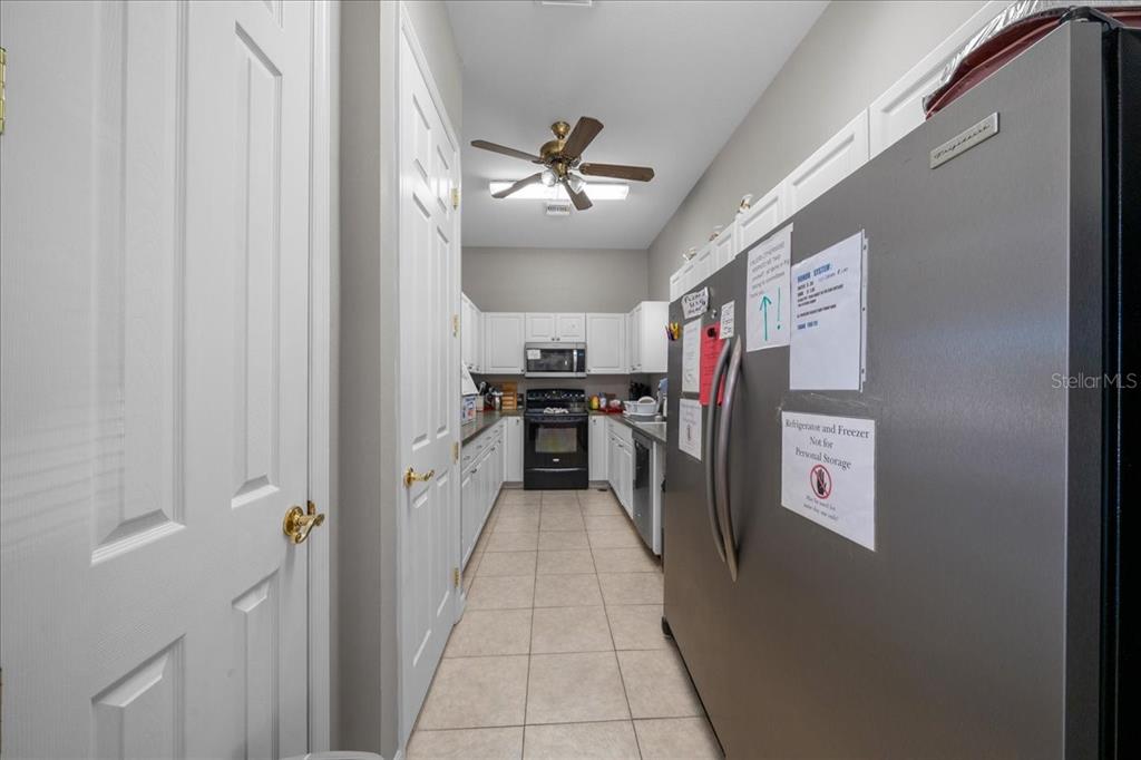 3047 Northeast 102nd Ave Road Silver Springs, FL 34488 - Photo 81 of 87 a kitchen with stainless steel appliances granite countertop a refrigerator and a sink
