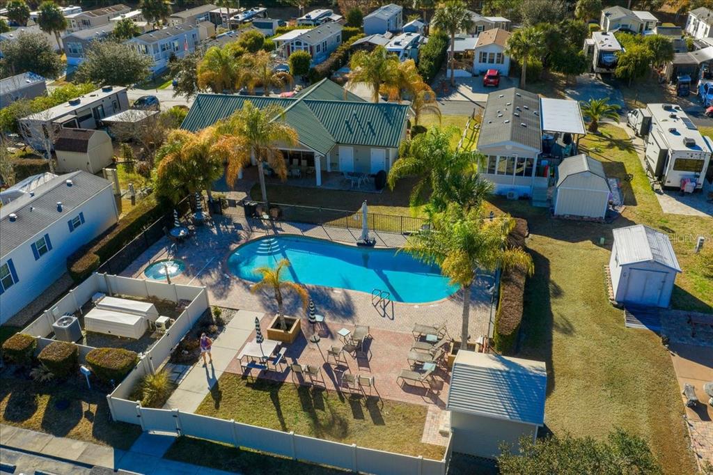 3047 Northeast 102nd Ave Road Silver Springs, FL 34488 - Photo 83 of 87 an aerial view of a house with swimming pool and outdoor seating