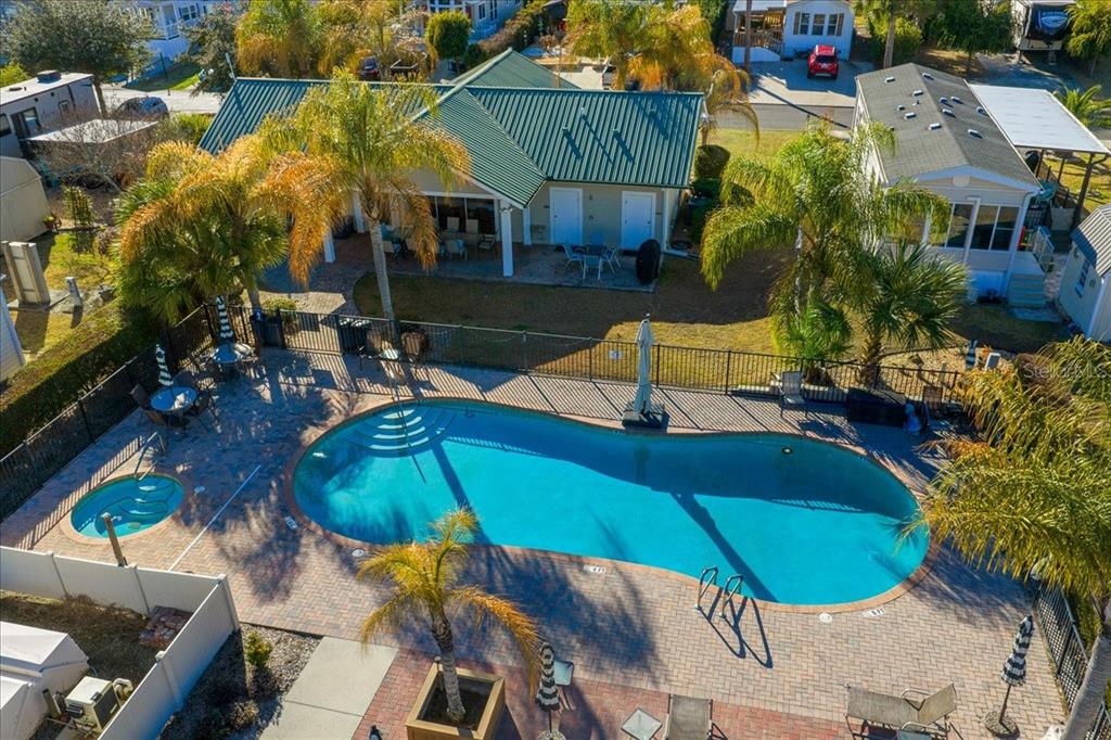 3047 Northeast 102nd Ave Road Silver Springs, FL 34488 - Photo 84 of 87 an aerial view of a house with outdoor space swimming pool and furniture