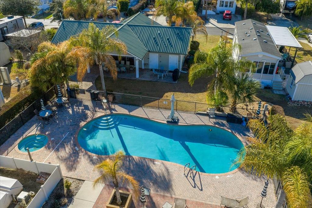 3047 Northeast 102nd Ave Road Silver Springs, FL 34488 - Photo 86 of 87 an aerial view of a house with swimming pool and patio