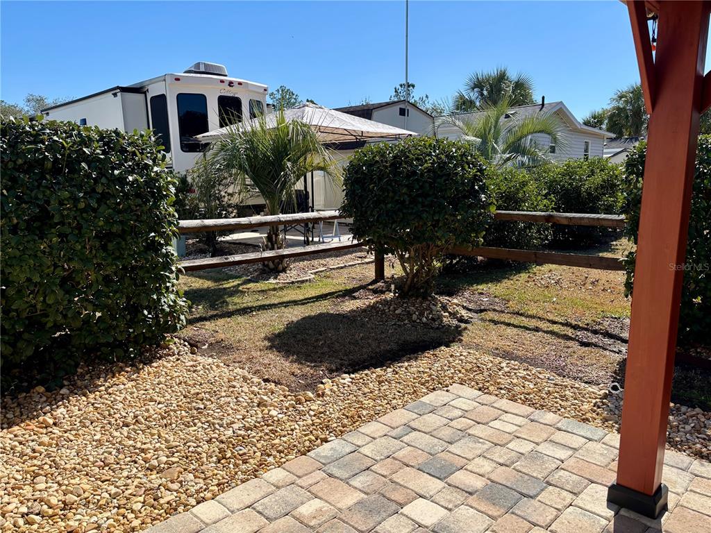 3047 Northeast 102nd Ave Road Silver Springs, FL 34488 - Photo 10 of 87 a view of a backyard with plants