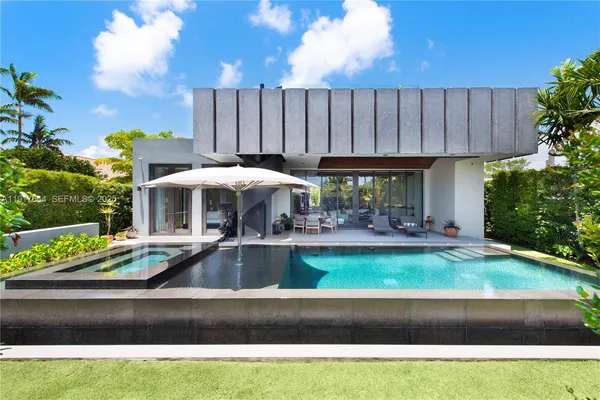 a view of a swimming pool with a patio