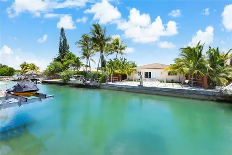 a house view with swimming pool and sitting space
