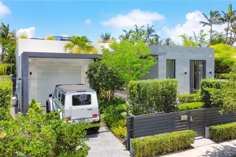 a view of a chairs setting in the backyard